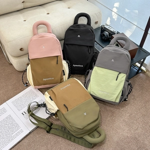 Collection of lightweight nylon mini backpacks in various trendy color block designs