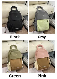 Macro shot of waterproof nylon backpacks in four colors with durable top handles and side cords