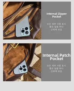 Detailed interior of vintage brown leather bag showing zipper pocket and phone compartment