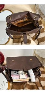 Detailed view of spacious inner compartments and secure pockets in brown vintage messenger bag