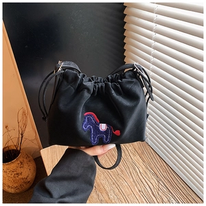 Detail of black drawstring bucket bag featuring a purple pony embroidery and PU leather texture