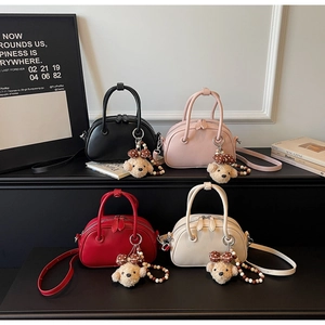 Selection of minimalist bowling shoulder bags in four colors with cute teddy bear charms