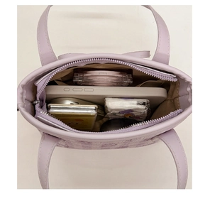 Top view of lavender tote bag interior showing spacious capacity for phone and makeup