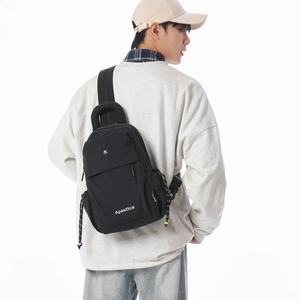 Close-up of the black Apasttca crossbody bag with multi-layer zippers and side drawstring