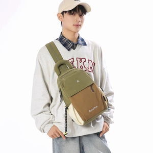 Close-up of color-block crossbody chest bag in olive green and beige wear-resistant nylon