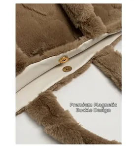 Detail of the magnetic snap closure on the brown faux fur tote bag with white lining