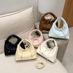 French retro dumpling bags in multiple colors with bow detail and leather texture