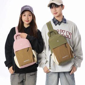 Detail showing high-capacity travel backpacks in pink and olive green color-blocking style