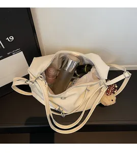 Interior view of soft cream leather bag showing large capacity for cosmetics and teddy charm