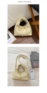 Macro view of cream dumpling bag in pebble grain leather with ribbon detail