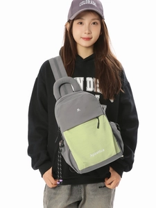 Modern two-tone sports chest bag in grey and green nylon with adjustable strap