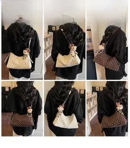 Polka dot canvas crescent shoulder bags in cream and brown with cute bear charms