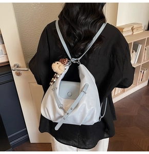 Light blue PU leather backpack with vintage texture and cute plush puppy keychain charm