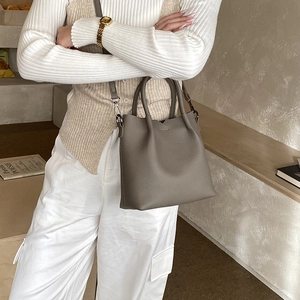 Taupe pebbled leather tote bag with dual handles and long shoulder strap for women