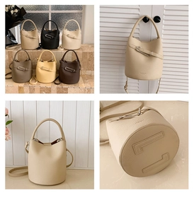 Close-up of litchi grain leather bucket bag featuring unique metal buckle and detailed strap