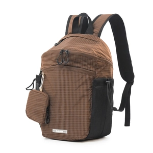 Macro view of brown checkered nylon backpack with mini pouch and mesh side pocket