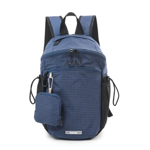 Detail view of large navy plaid nylon backpack with waterproof fabric and mini side pouch