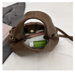 Top view showing the spacious interior of this chocolate brown crossbody cloud bag