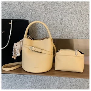 Detailed set of light yellow bucket bag with inner pouch and cute bear pendant