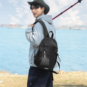 Close-up of lightweight nylon plaid backpack with a detachable mini pouch and side cords
