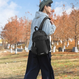 Detailed view of black checkered nylon backpack with side pockets and kairuide woven label