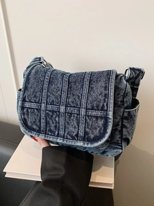 Vintage blue denim crossbody bag with quilted stitching and multiple pockets for women