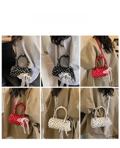 Rear view of model wearing polka dot cylinder bags in black, red, and white versions