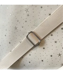 Detail view of the adjustable thick woven shoulder strap with polished silver metal buckle