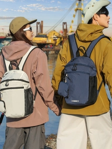 Waterproof nylon plaid backpack for travel in beige and navy blue with mini pouch