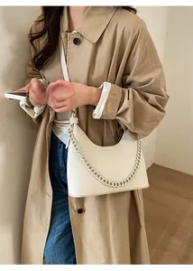 Chic off-white half-moon hobo bag with textured leather and chunky chain strap detail