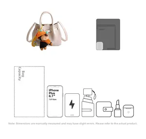 Detail view of stylish beige handbag capacity showing storage for phone, wallet, and essentials