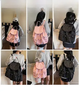 Polka dot drawstring backpack showing pink and black versions with star print details