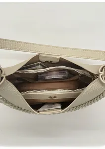 Top view of the off-white pebbled leather bag interior with multiple compartments