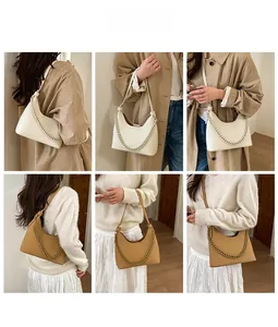 Detail shots of minimalist half-moon shoulder bags with chain in beige and tan leather