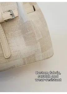 Detail of the custom textured woven fabric on the handbag with scratch-resistant surface