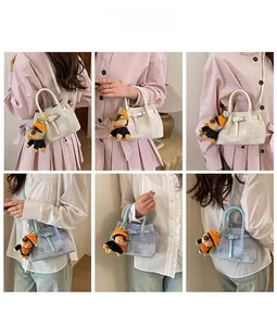 Detail shots of mini woven bucket bags with dog plush pendant shown from multiple angles