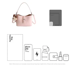 Detail showing the internal storage capacity of the pink faux leather underarm bucket bag