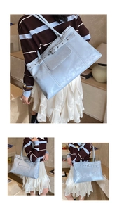 Detailed views of light blue tote bag with buckle straps and stylish metal rivets