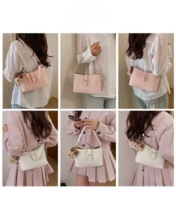 Detail shots of pink and white faux leather hobo bags with cute plush bear charms