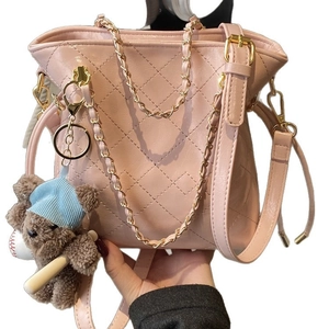 Pink quilted bucket bag with gold chain strap and cute bear pendant for daily use