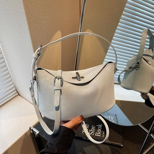 Elegant light blue leather bucket bag with silver metal swivel lock and adjustable strap