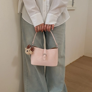 Pink PU leather underarm bag with a cute brown plush bear charm and silver buckle