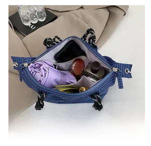 Top view of blue plaid canvas tote bag showing interior storage capacity for daily items