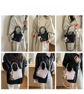 Collage of black and pink bucket bags shown in various crossbody and handheld style poses