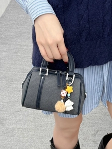 Boston bag in dark gray twill with black leather trim and decorative pendants