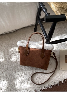 Detail of retro brown plush bucket bag with floral embossing and soft faux fur trim