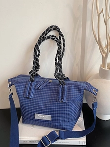 Blue plaid crossbody handbag with woven rope handle and adjustable fabric shoulder strap