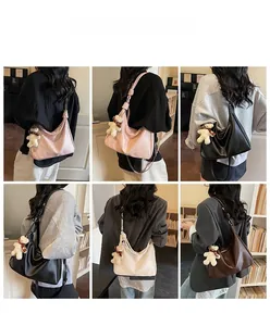 Hobo tote bag details showing large capacity design and cute bear plush charm accessory