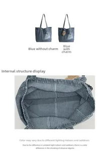 Close-up of blue denim tote bag interior showing striped lining and spacious inner structure