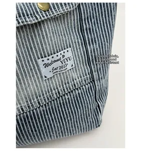Detail of blue striped canvas tote bag showing durable scratch-resistant textured fabric